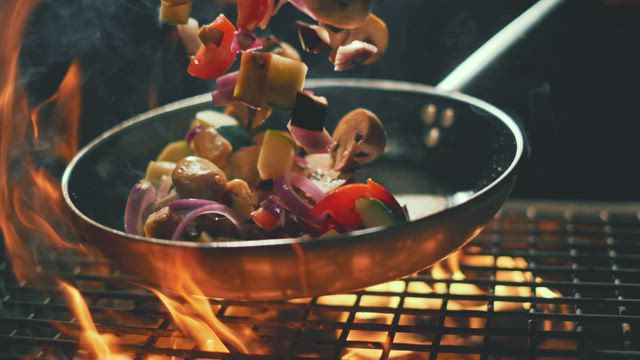 Vegetables into the pan in slow motion.